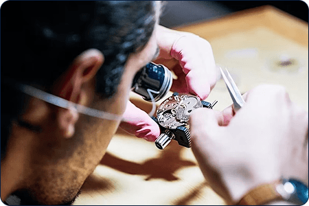 Expert horologist examining watch
